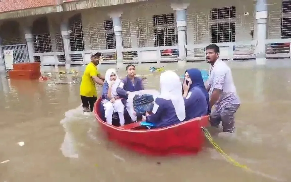 HSC candidates walk through waist-deep water to reach exam centres in Cumilla