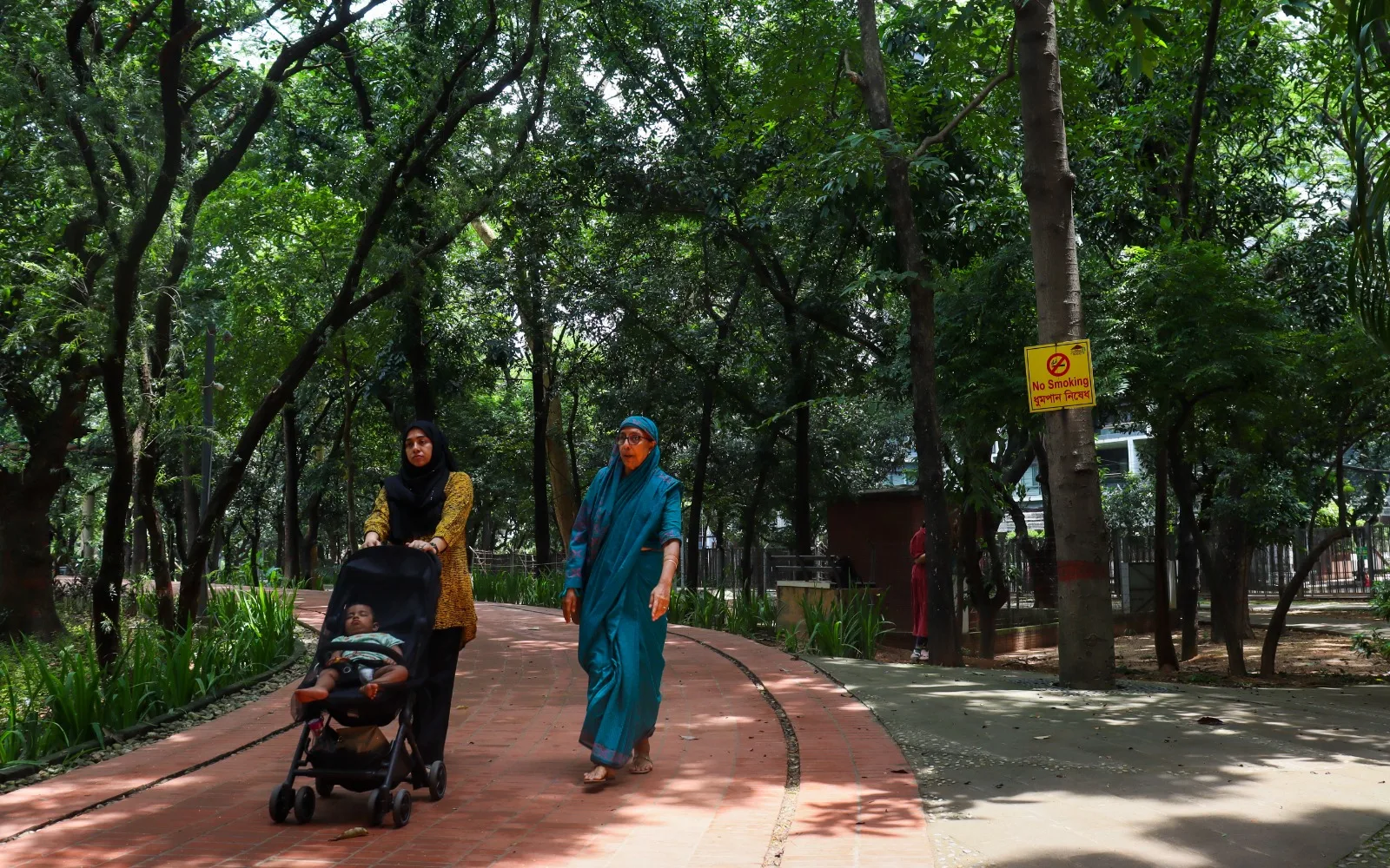 Three generations walk together through Justice Shahabuddin Ahmed Park. Wasiul Bahar/Nutshell Today